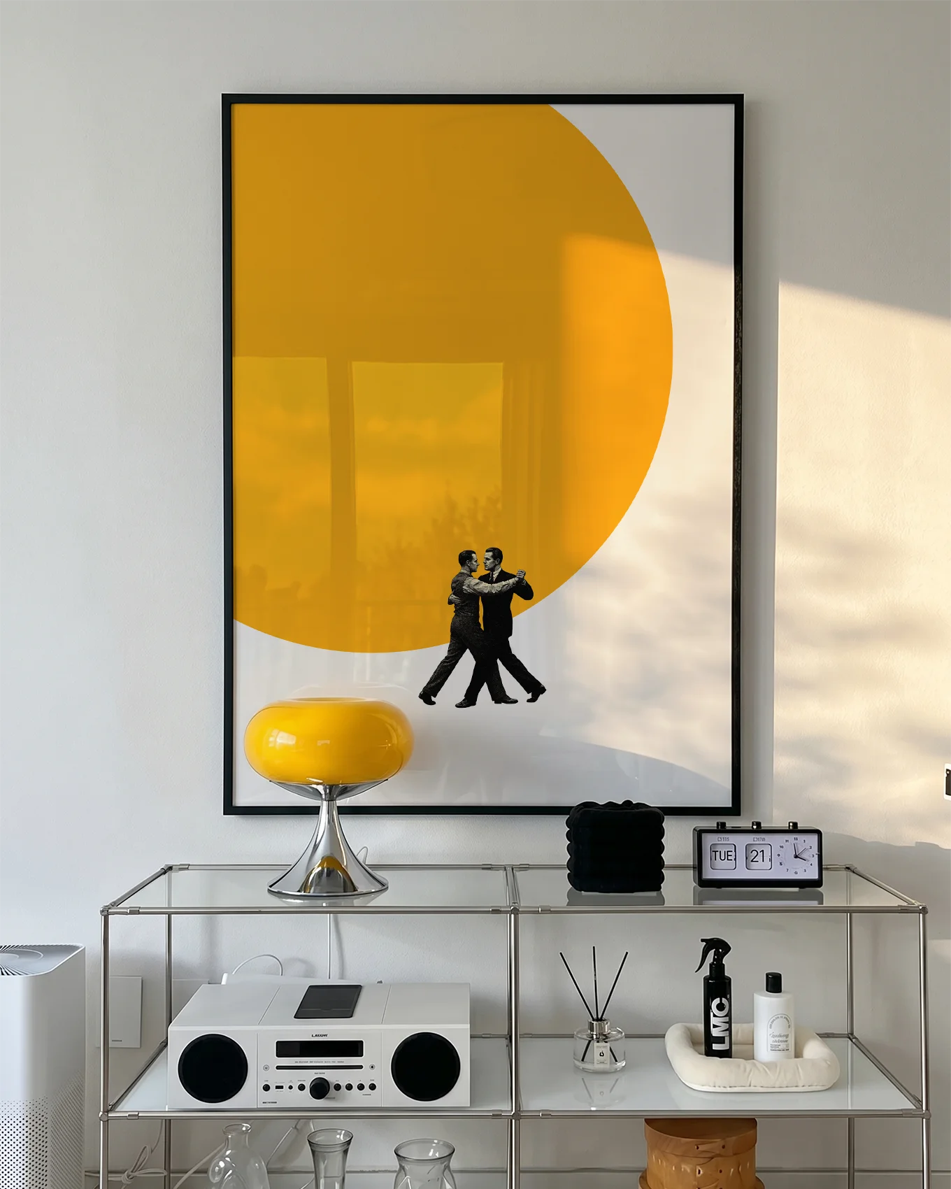 A poster of two men dancing in front of a big, yellow sun.