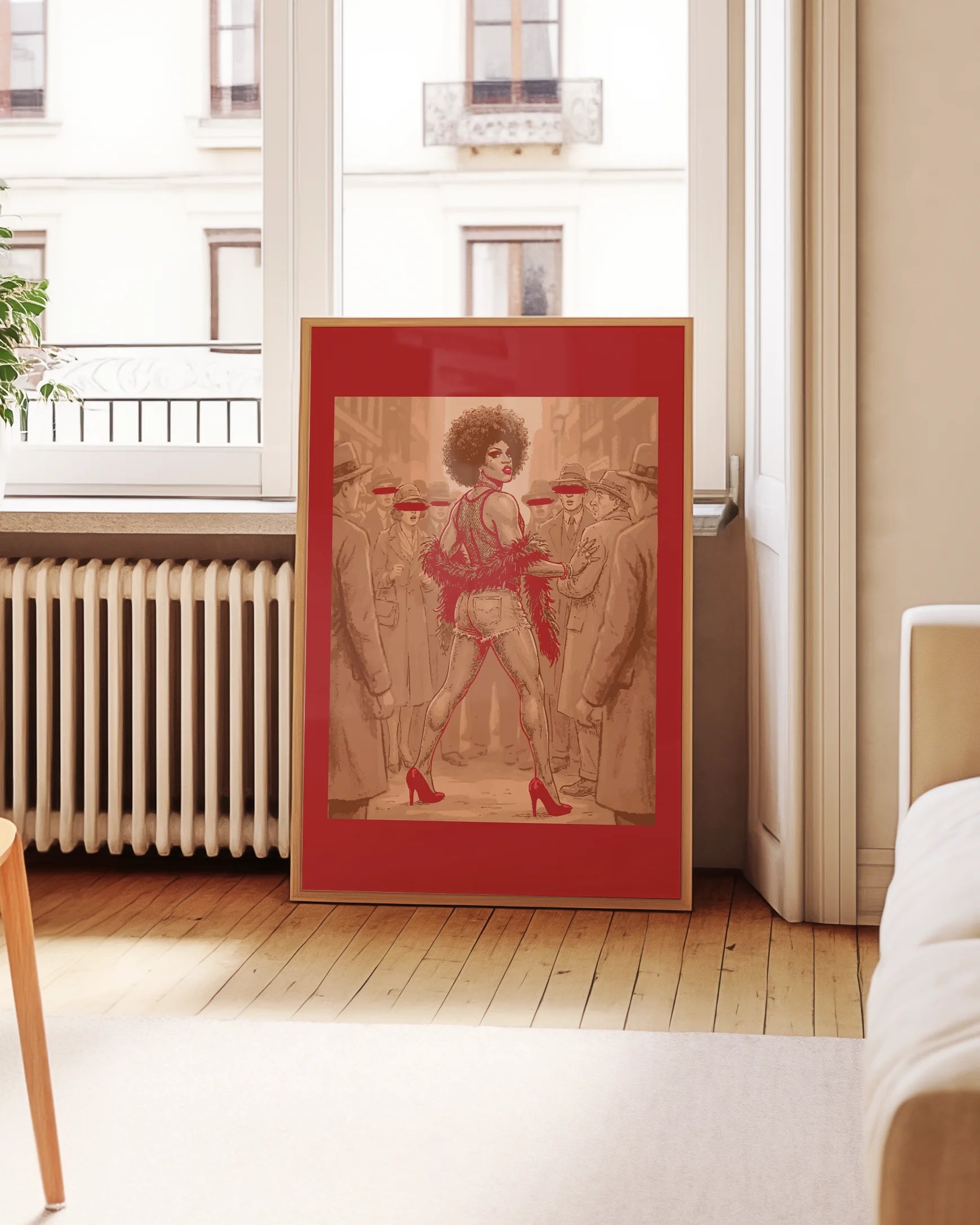 A framed poster featuring a fabulous drag queen standing in the middle of a crowd where every other face is blurred and anonymous. She’s the star — the rest is just background noise.