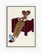 A framed poster with two gay men hugging.