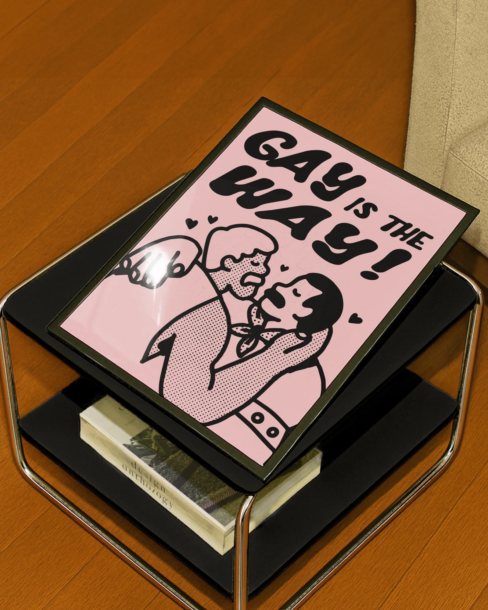 A poster with two gay men kissing with the text 'GAY IS THE WAY!'