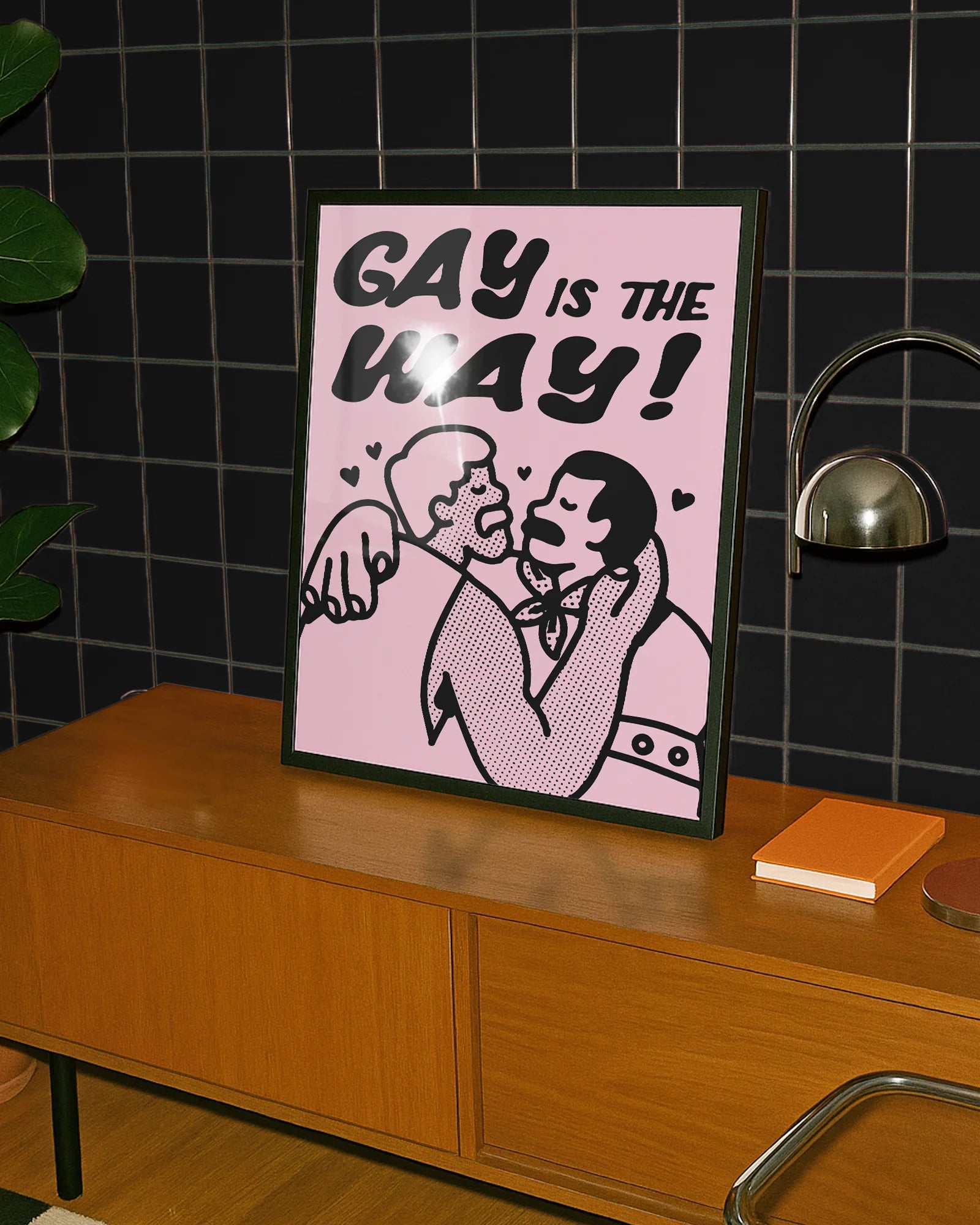 A poster with two gay men kissing with the text 'GAY IS THE WAY!'
