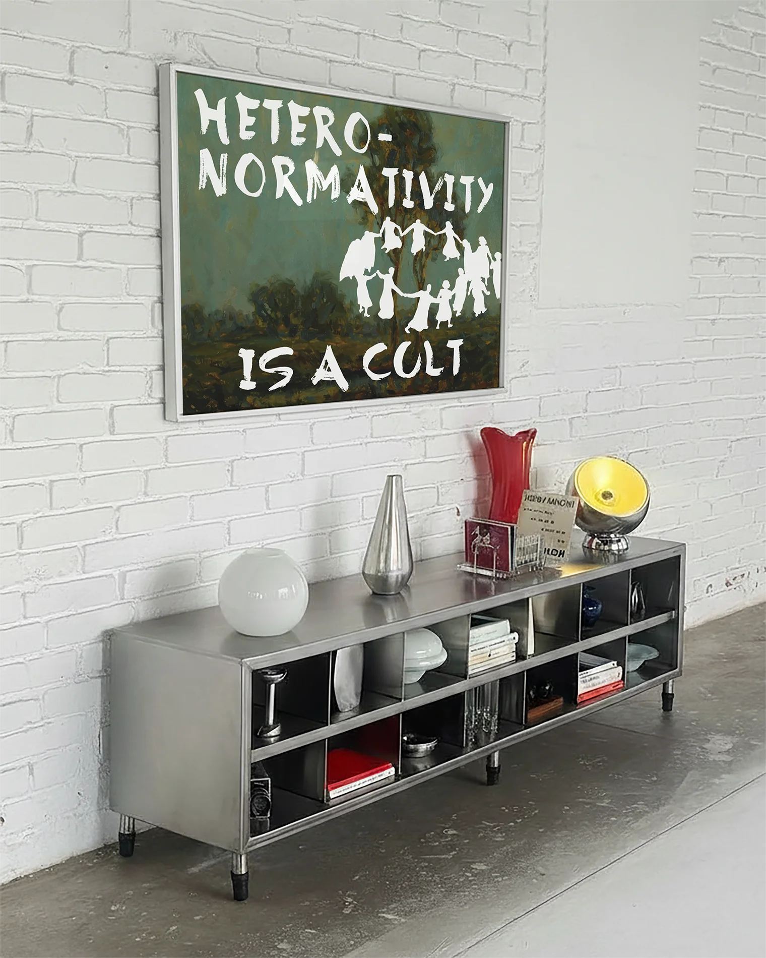 A framed poster depicting a group of people dancing in a cult-like circle, accompanied by the text “Heteronormativity Is a Cult.”