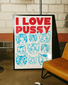A framed poster with nine catheads and the text 'I LOVE PUSSY....cats'.