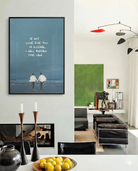 En poster som föreställer två män som springer hand i hand mot havet med texten 'IF MY LOVE FOR YOU IS ILLEGAL, I WILL BREAK THE LAW'.