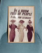 A poster with three ladies in vintage style holding binoculars with the text 'In a room full of people, I look for lesbians'.