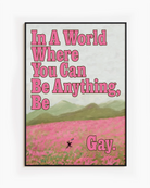 A poster of a person running through an open field of pink flowers, with a pride flag and the text: 'In a world where you can be anything, be gay'.