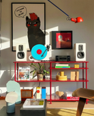 A framed print with a black, punk cat with the text 'It's punk to be gay'.