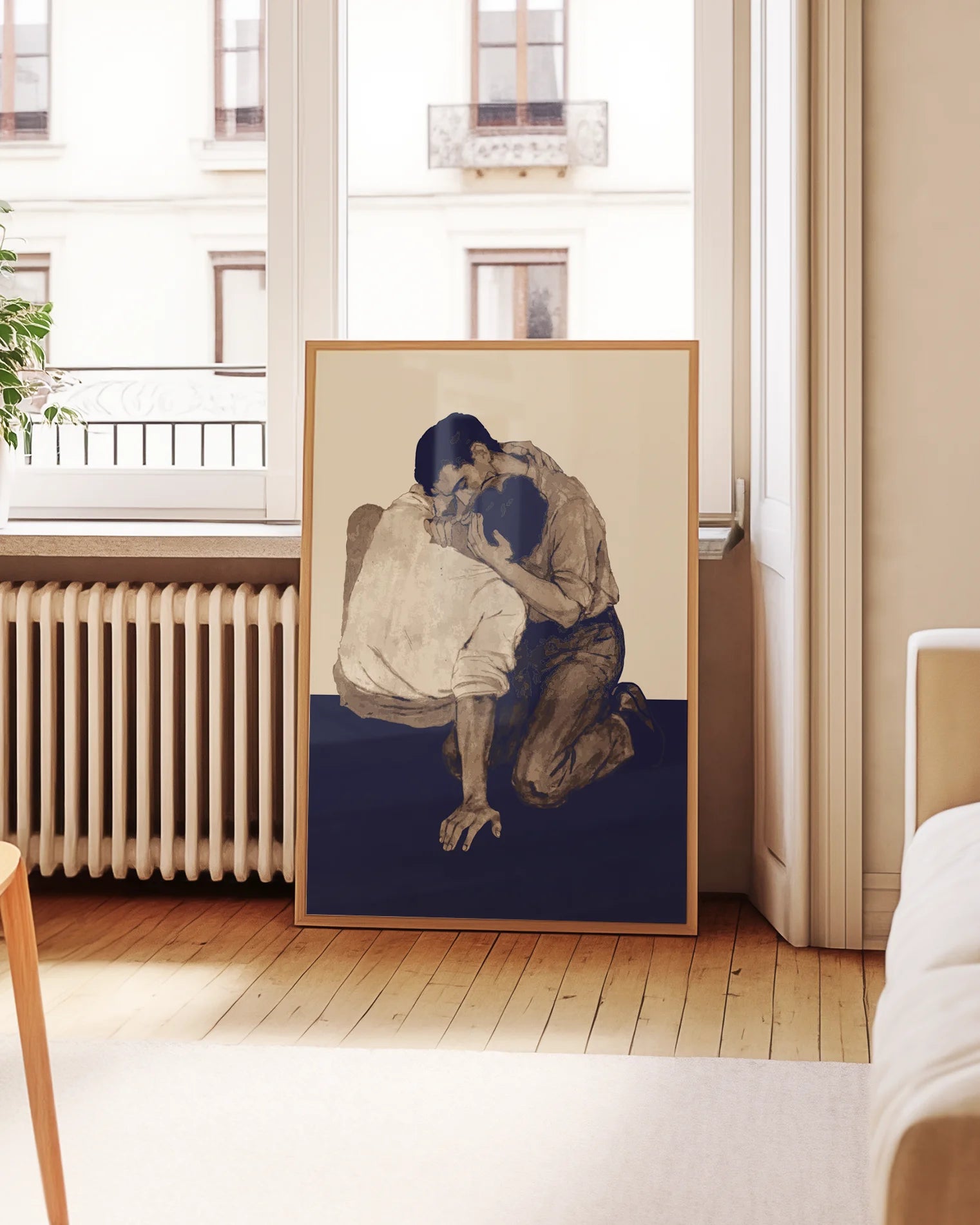 A poster with two men kissing on the floor.