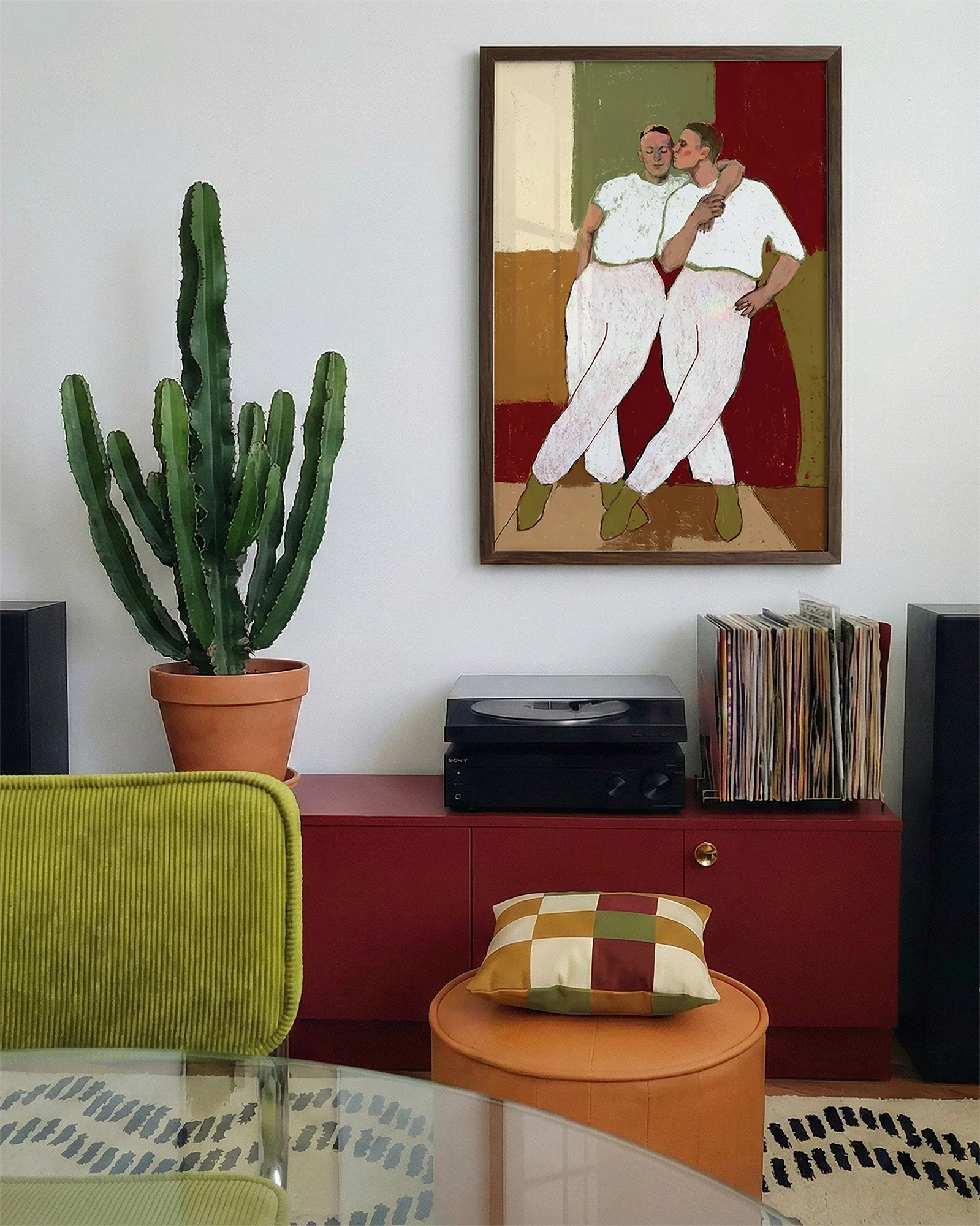 A framed poster with two gay men kissing each other on the cheek, abstract style.