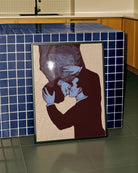 A framed poster with two gay men kissing, pop art style.