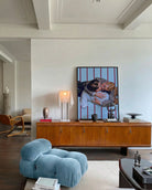 A framed print with a gay couple in the 1940's kissing on the floor. Vintage and retro style.