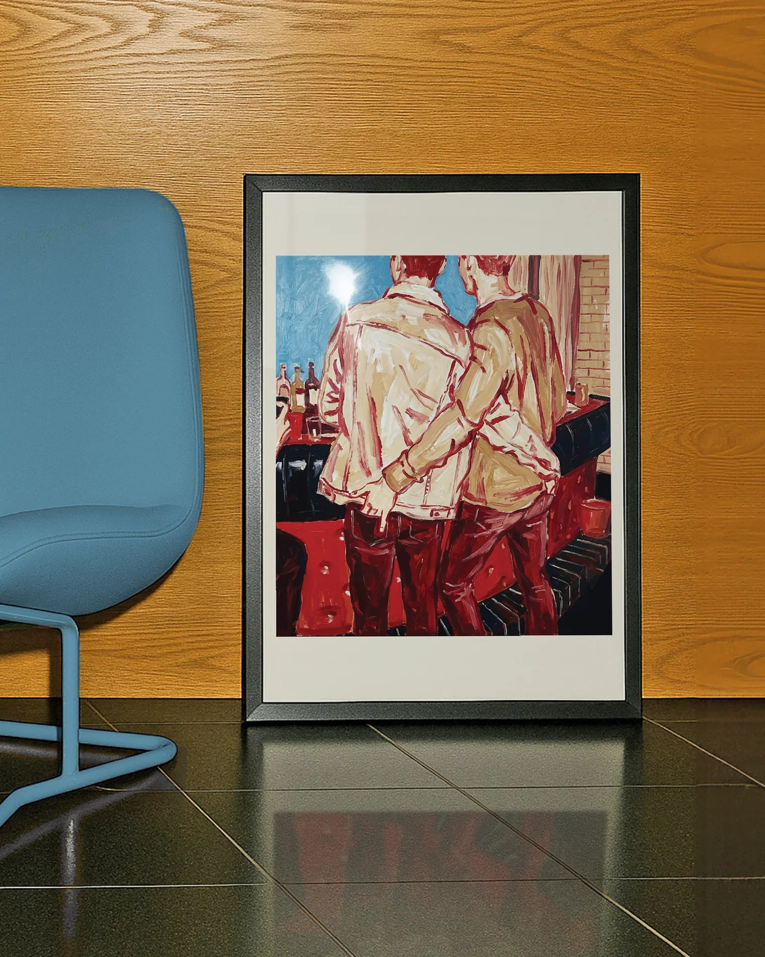 A framed poster with two gay men in a bar, ordering a drink with their hand in each other's backpockets.