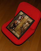 A framed poster depicting two men kissing, hidden behind a locker in a changing room, dressed in basketball gear, while the rest of the team prepares around the corner, 1960's vintage style.