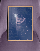 A poster with two gay men hugging each other in a dark blue lake.