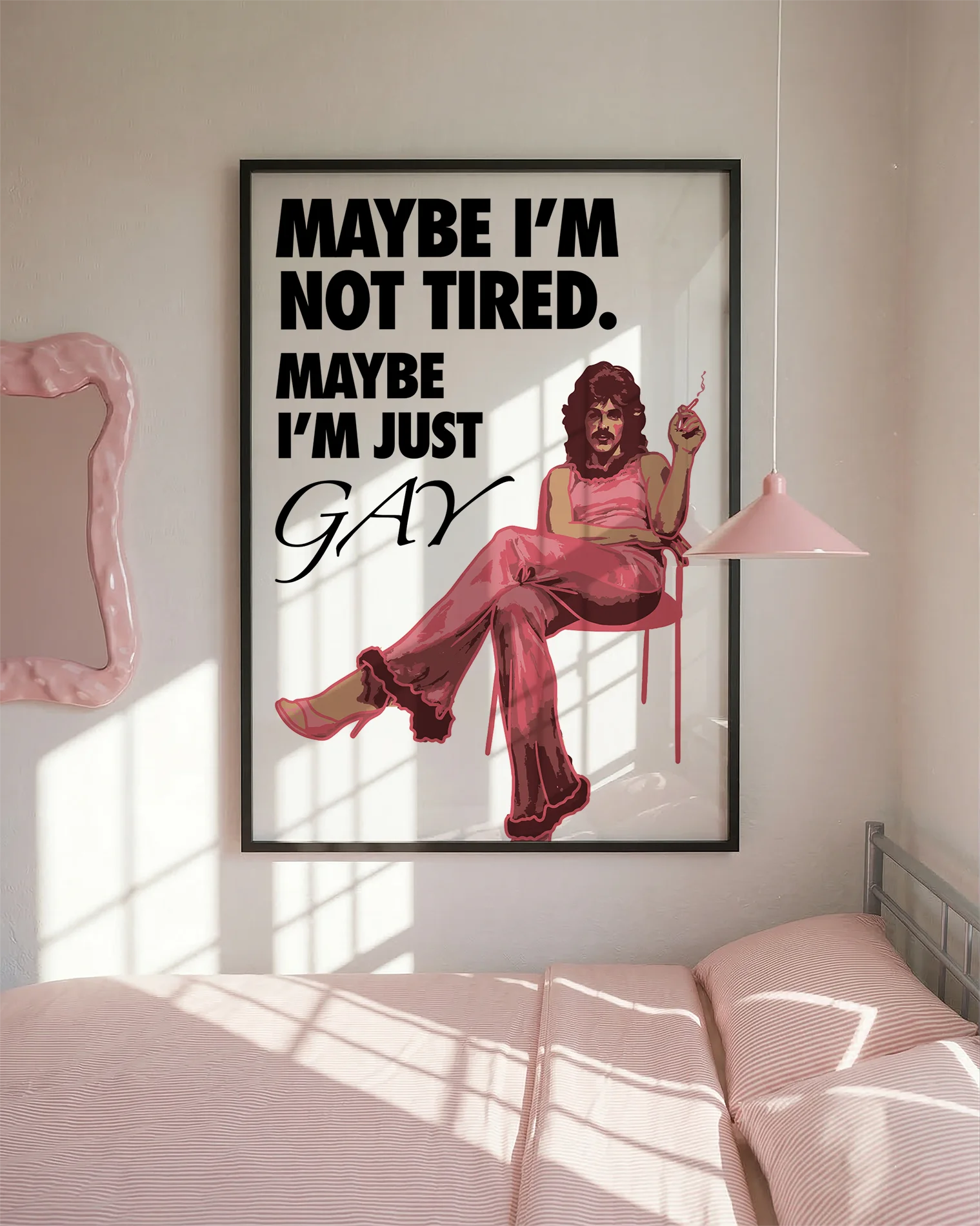 The poster features a fabulous person in pink clothing, heels and a 70s hairstyle with the text 'MAYBE I'M NOT TIRED. MAYBE I'M JUST GAY.'