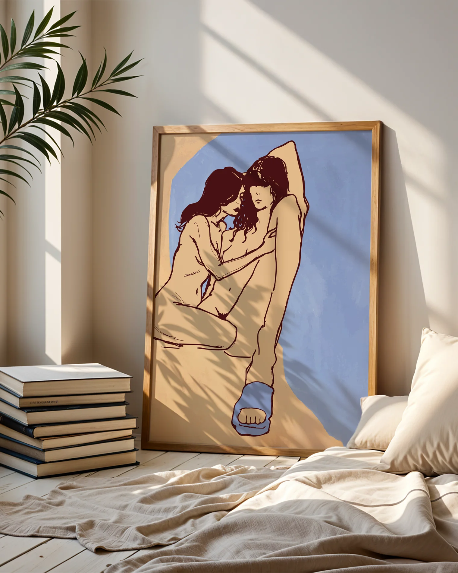 A framed poster with a lesbian, naked couple in an abstract style.