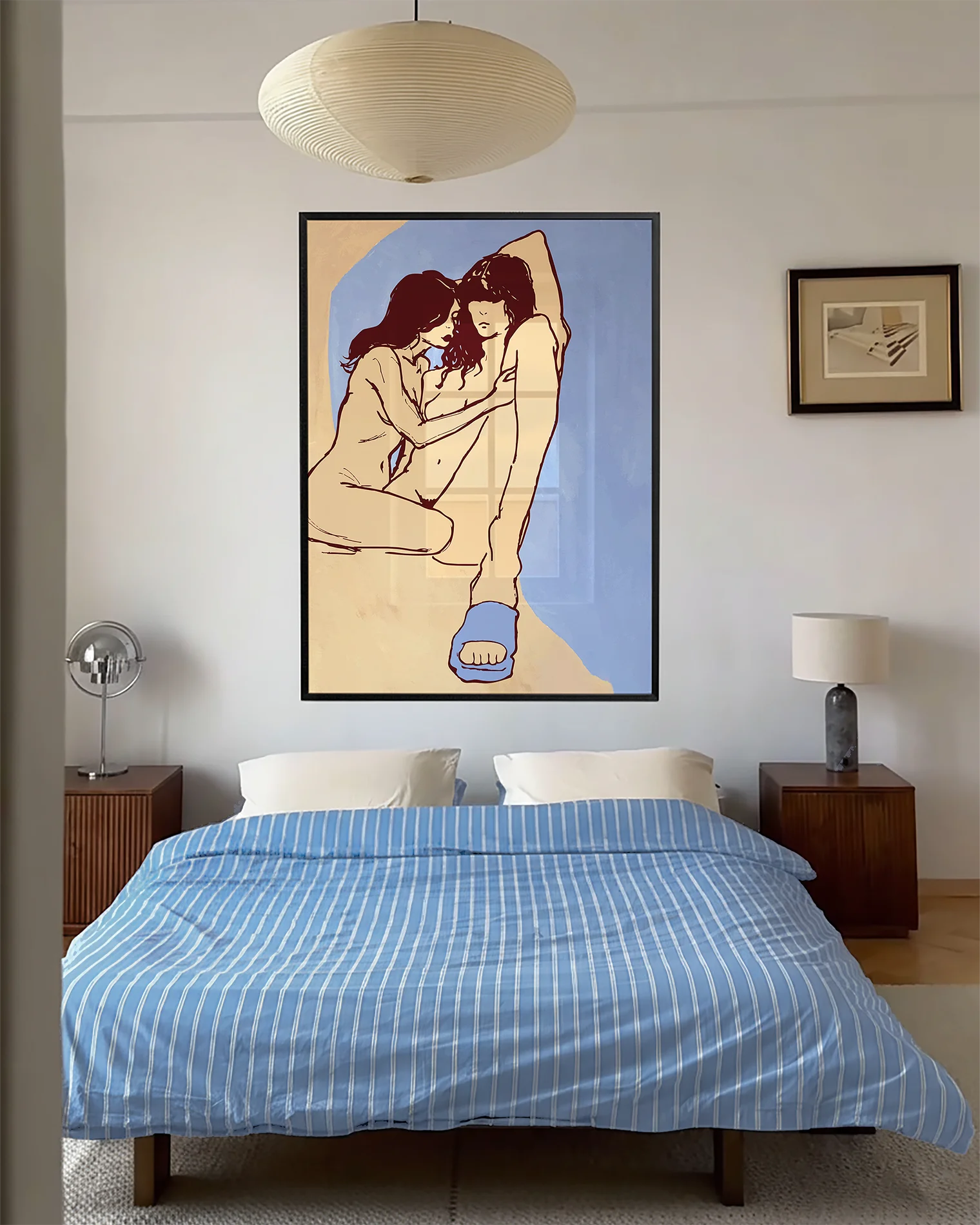 A framed poster with a lesbian, naked couple in an abstract style.