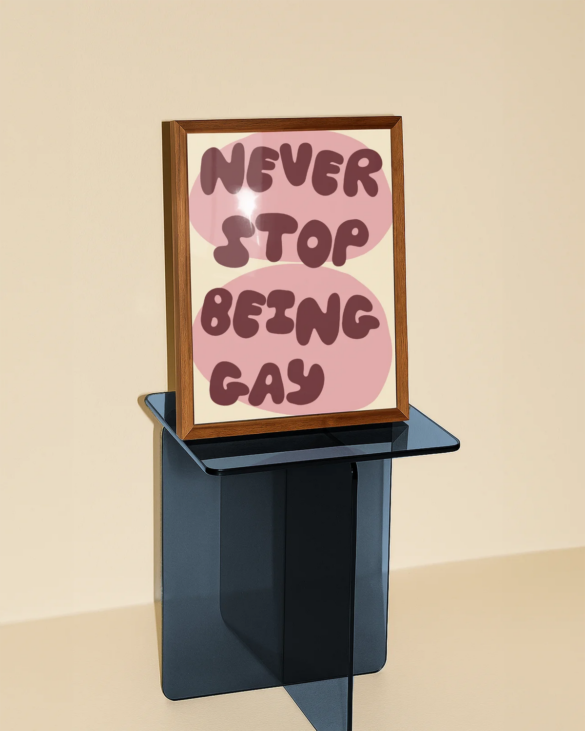 A poster with the text 'NEVER STOP BEING GAY'.