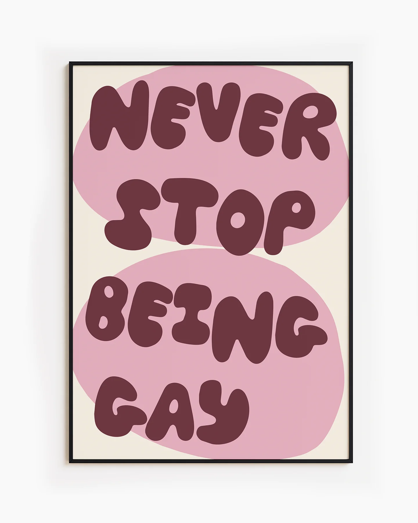 A poster with the text 'NEVER STOP BEING GAY'.