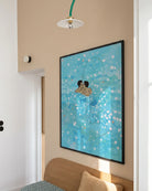 Two illustrated gay men kissing in blue and shiny water.