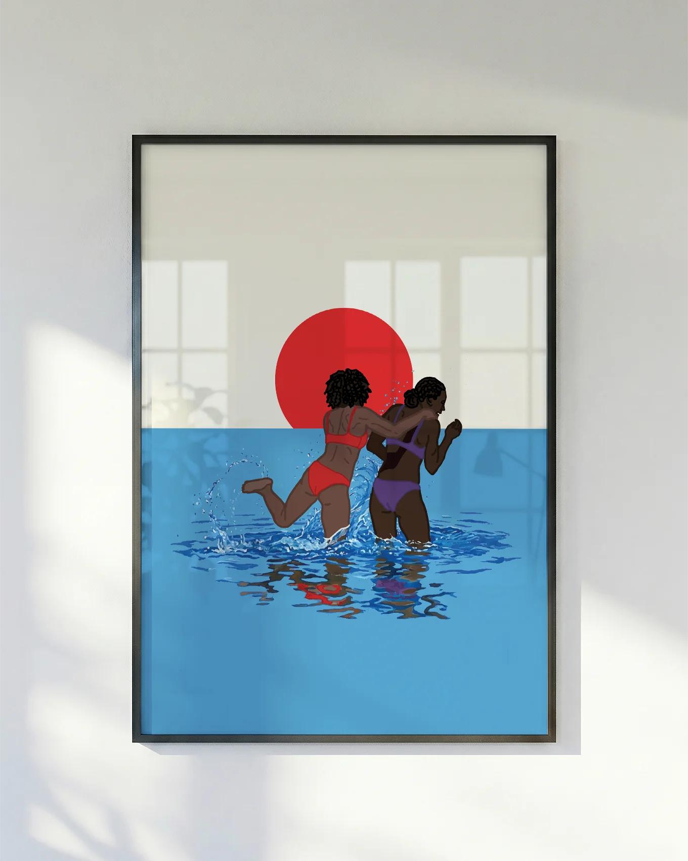 A poster with two lesbian girls playing in the ocean, in front of a sunset.