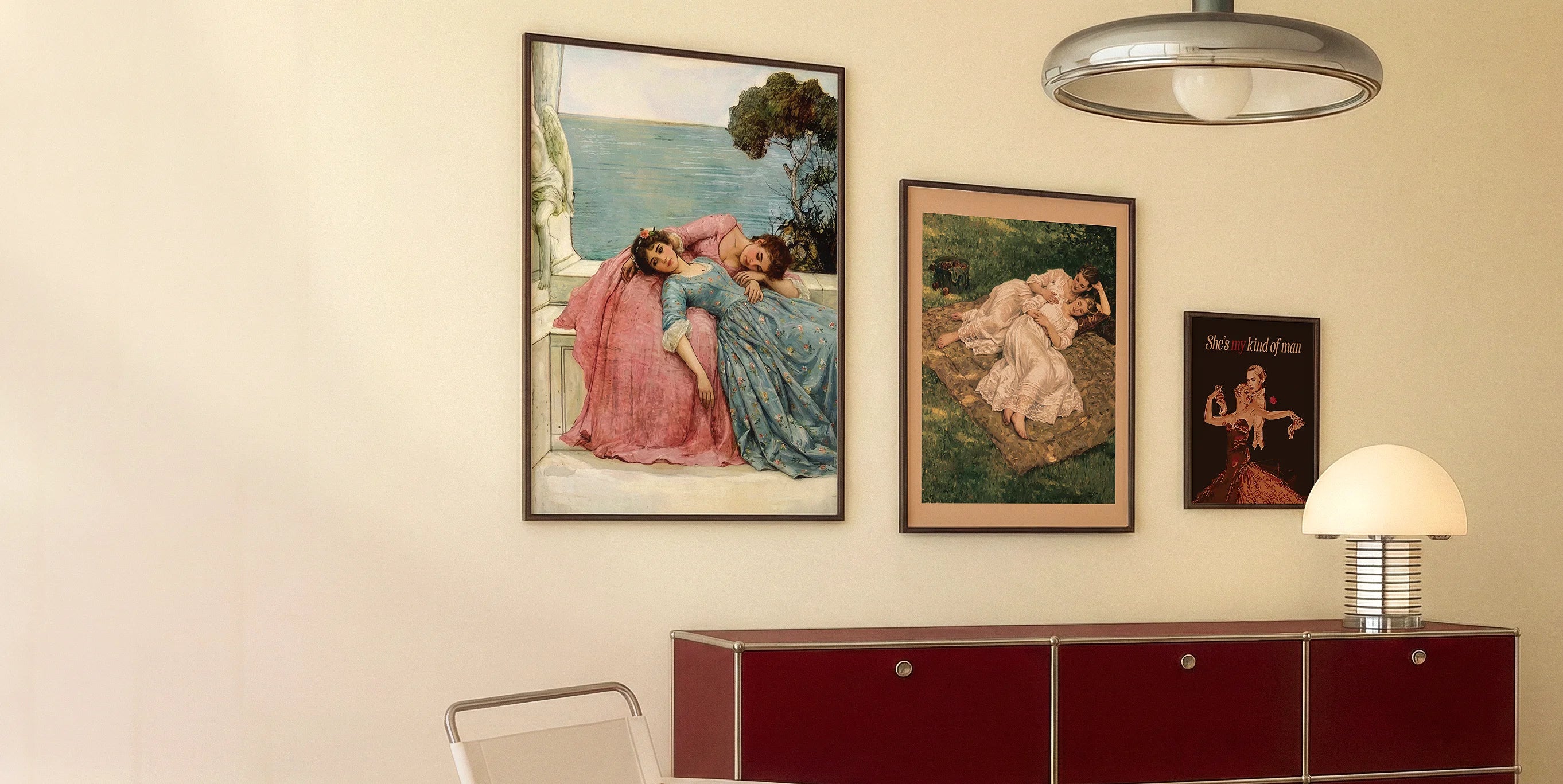 Three framed posters on a wall.