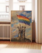 A framed poster with three gay men raising a Pride flag together, symbolizing unity, courage, and the ongoing fight for LGBTQIA+ rights.