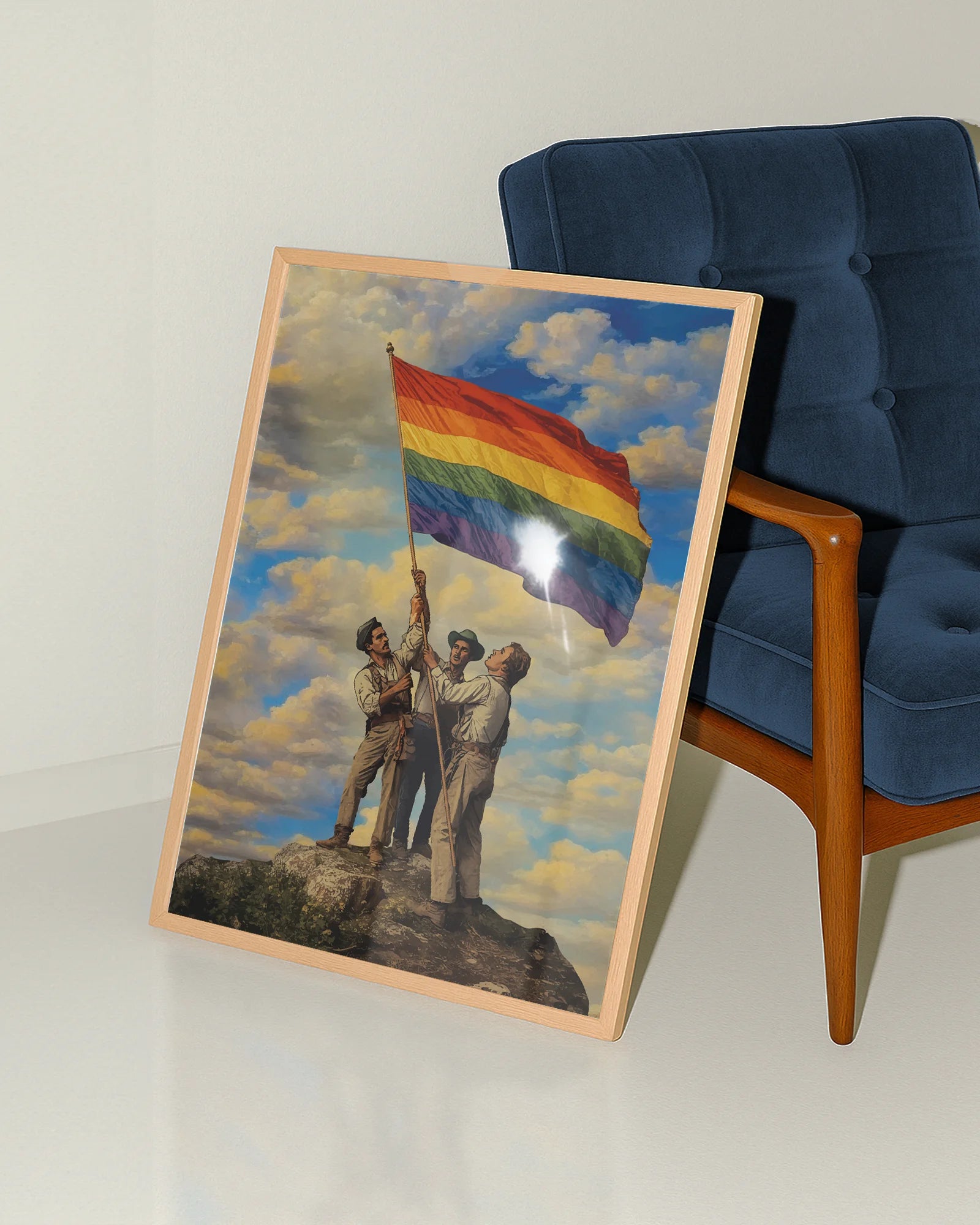 A framed poster with three gay men raising a Pride flag together, symbolizing unity, courage, and the ongoing fight for LGBTQIA+ rights.