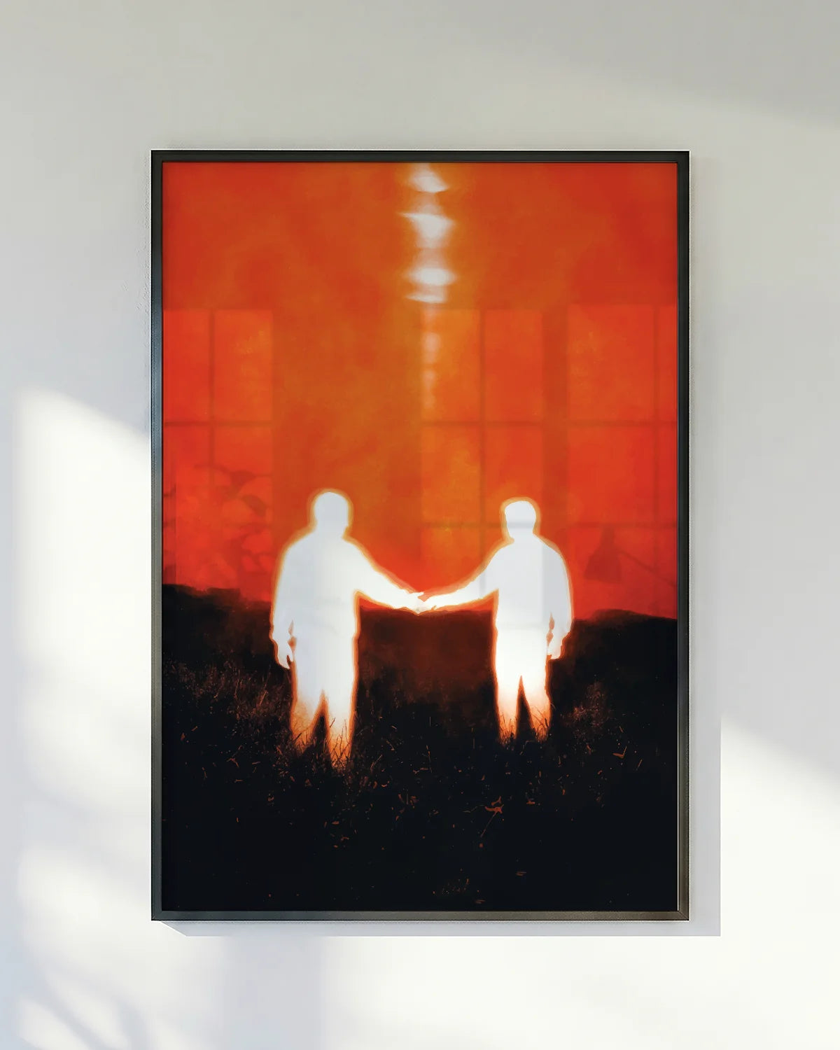 A poster of two men reaching out to each other.