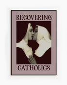 A framed poster featuring two kissing nuns, paired with the text "RECOVERING CATHOLICS."