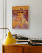 A framed poster with a lesbian, abstract couple.