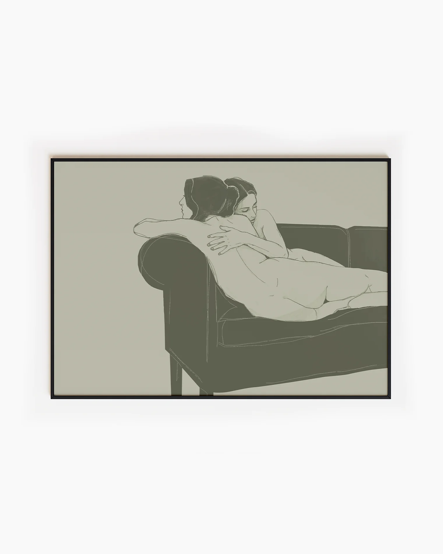 A framed, horizontal poster with two naked, lesbian ladies hugging tight on a couch.