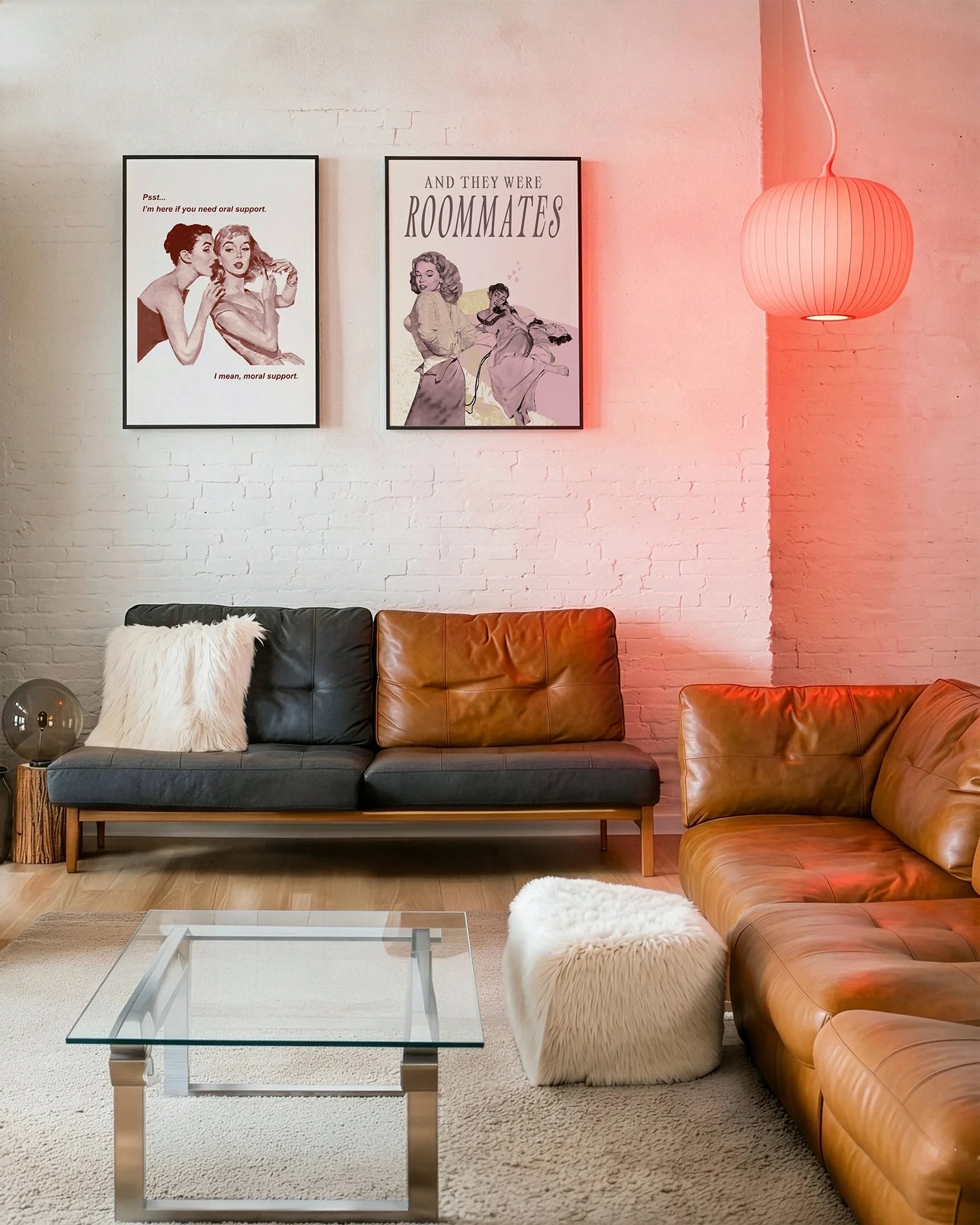 A gallery wall with several framed, queer posters in a living room.