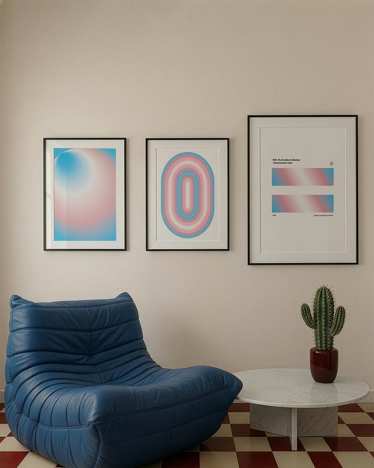 A gallery wall with several framed, queer posters in a living room.
