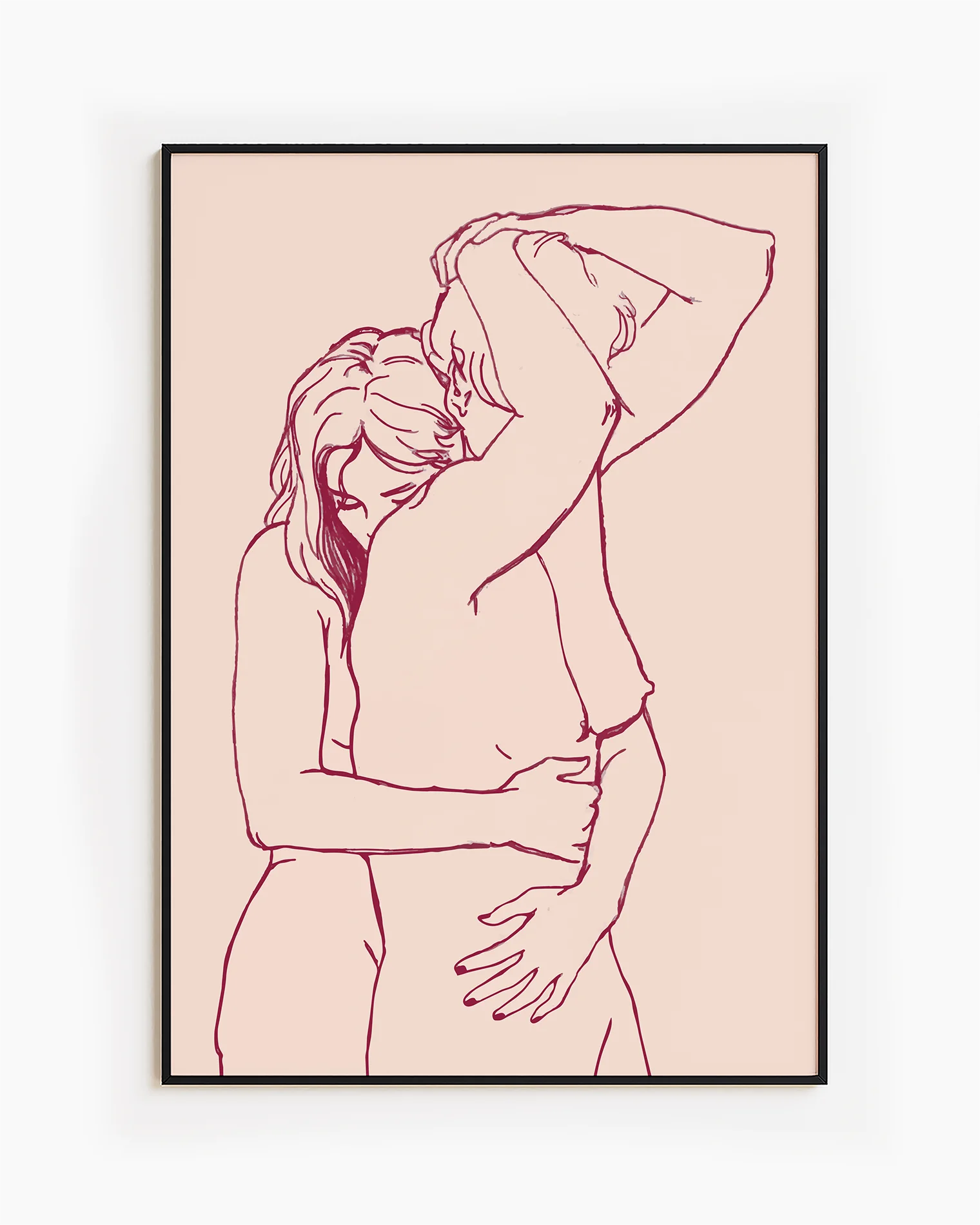 A framed print with two lesbian, naked girls hugging.