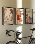 A framed poster featuring two women gossiping over tea, accompanied by the text: “Spilling The Tea – Verb – The act of sharing new or sensitive information, often exchanged in trusted queer company.”